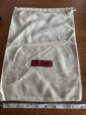 Valentino Garavani Beige Canvas Drawstring Bag with Burgundy Logo Patch